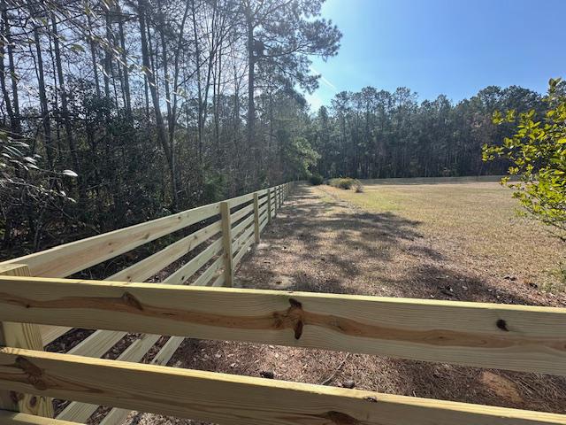 wood ranch rail fence installed by top rail fence
