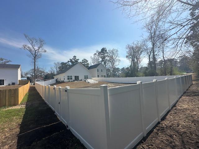 vinyl privacy fence installed by top rail fence