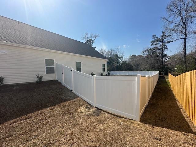 vinyl privacy fence installed by top rail fence