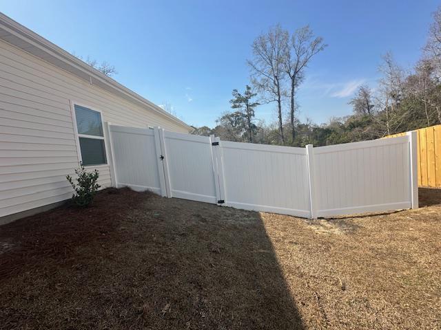 vinyl privacy fence installed by top rail fence