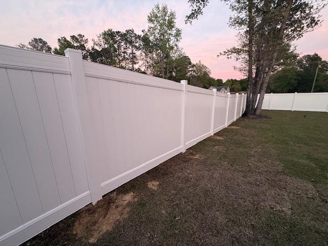 white vinyl privacy fence installed by top rail fence