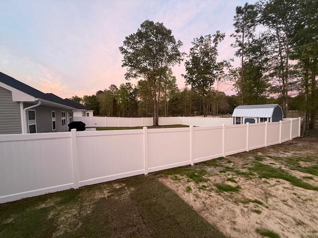 white vinyl privacy fence installed by top rail fence