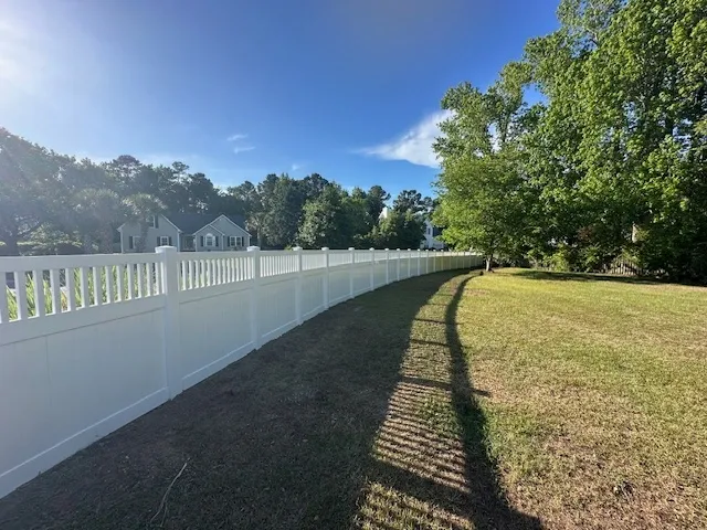 vinyl privacy fence installed by top rail fence