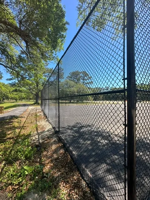 black chain link fence installed by top rail fence
