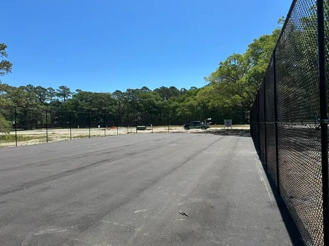 black chain link fence installed by top rail fence