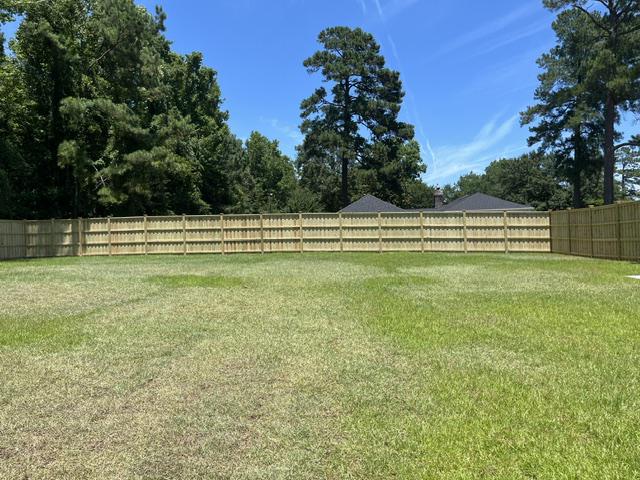 wood board on board cap and trim fence installed by top rail fence