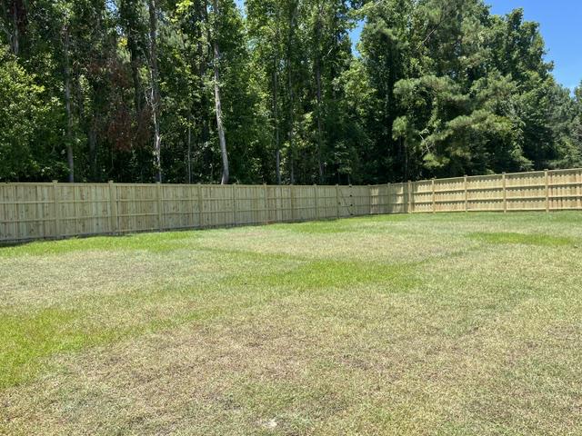 wood board on board cap and trim fence installed by top rail fence