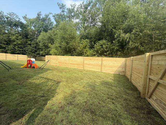 wood horizontal fence installed by top rail fence