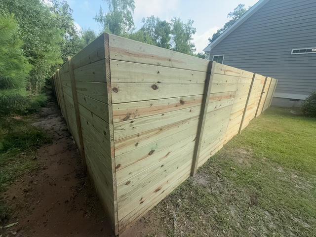 wood horizontal fence installed by top rail fence