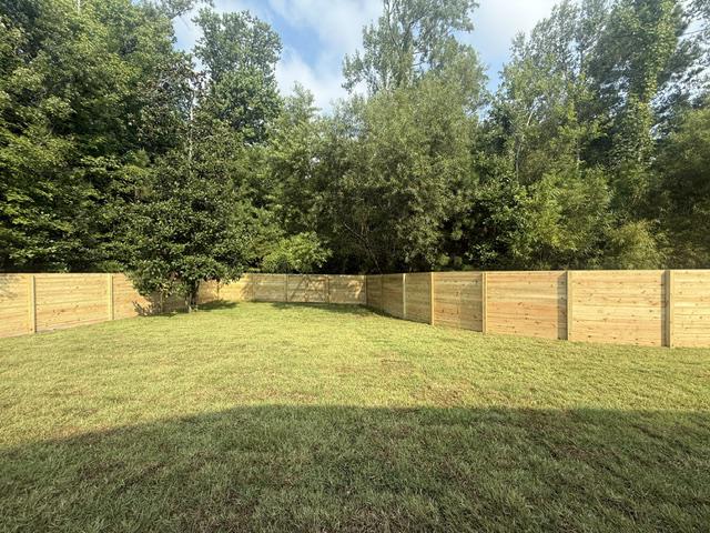 wood horizontal fence installed by top rail fence