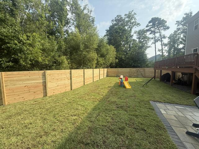 wood horizontal fence installed by top rail fence