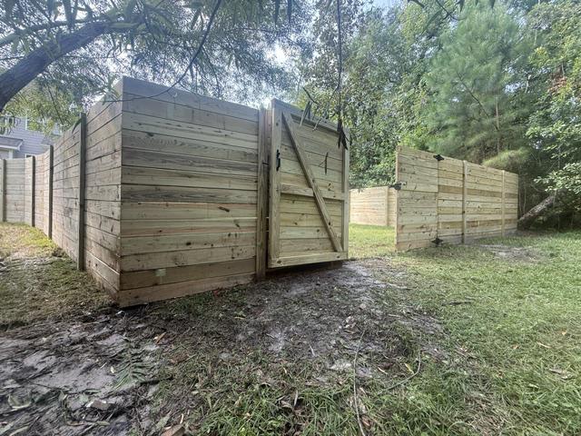 wood horizontal fence installed by top rail fence
