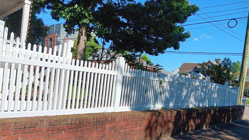 white vinyl picket fence railing