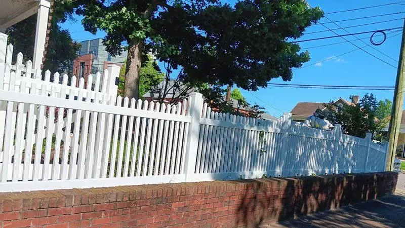 vinyl picket fence installed by top rail fence