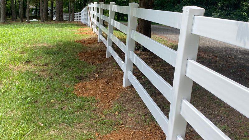 white vinyl ranch rail fence installed by top rail fence