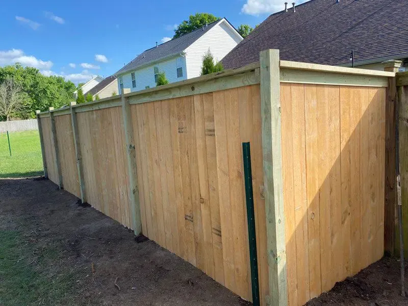  wood cap and trim fence installed by top rail fence