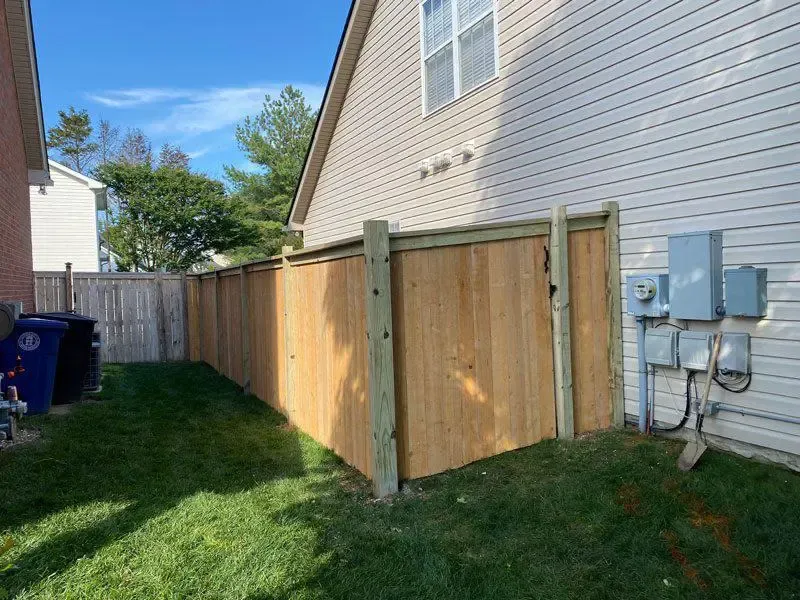 wood cap and trim fence installed by top rail fence