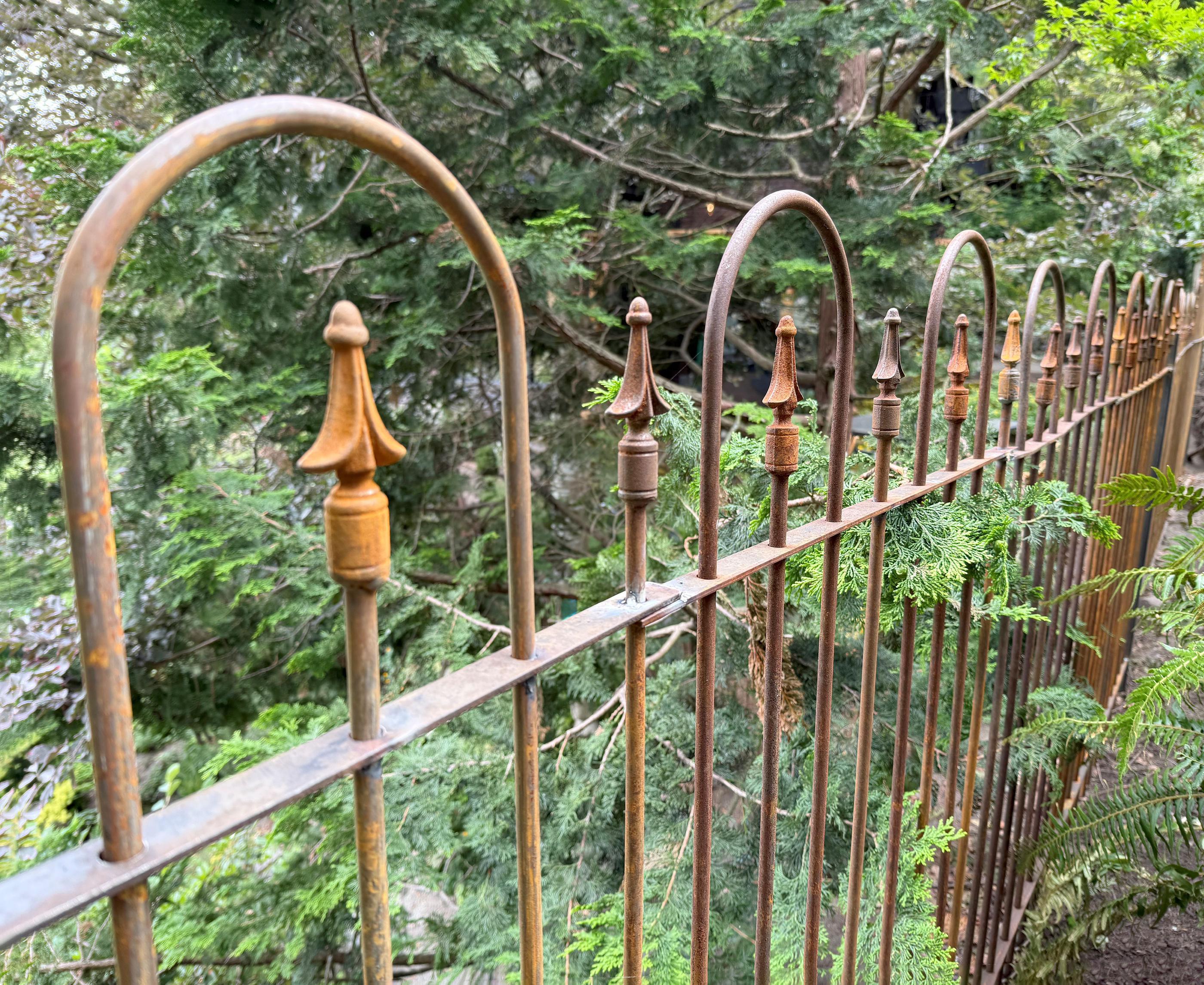 spear top ornamental metal fence installed by top rail fence