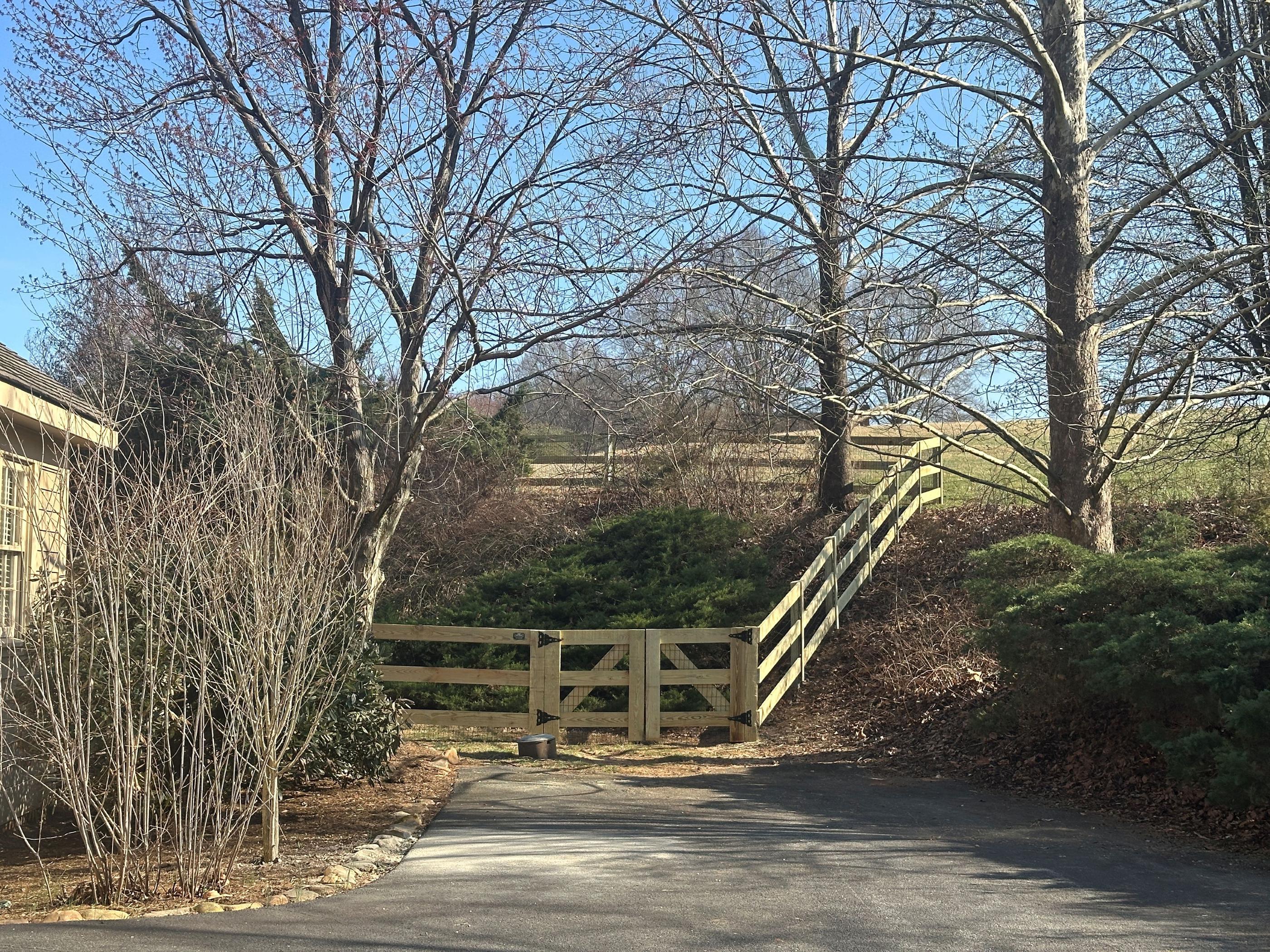 wood ranch rail fence installed by top rail fence
