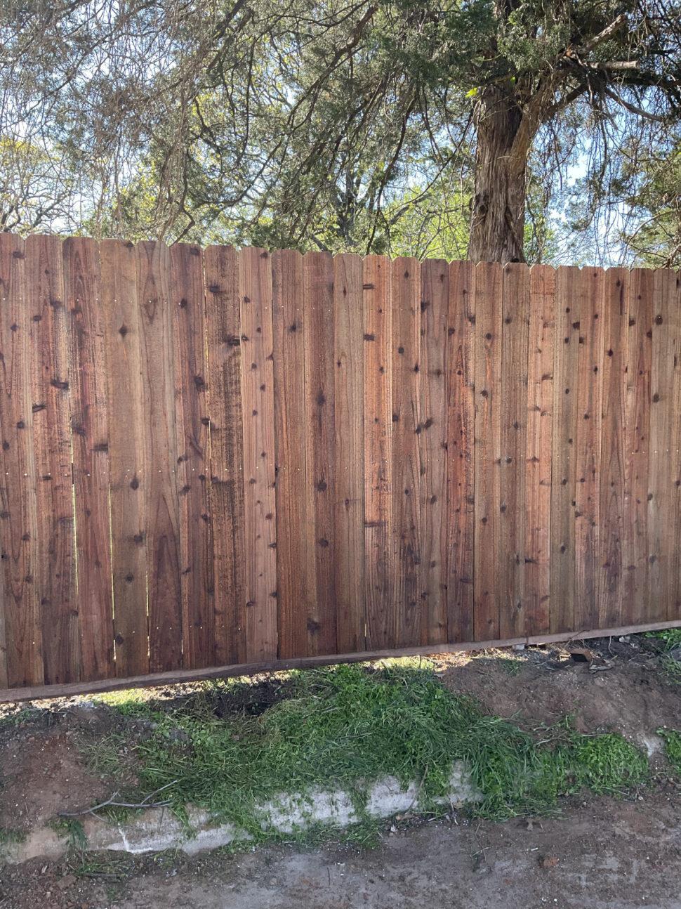 wood privacy fence installed by top rail fence