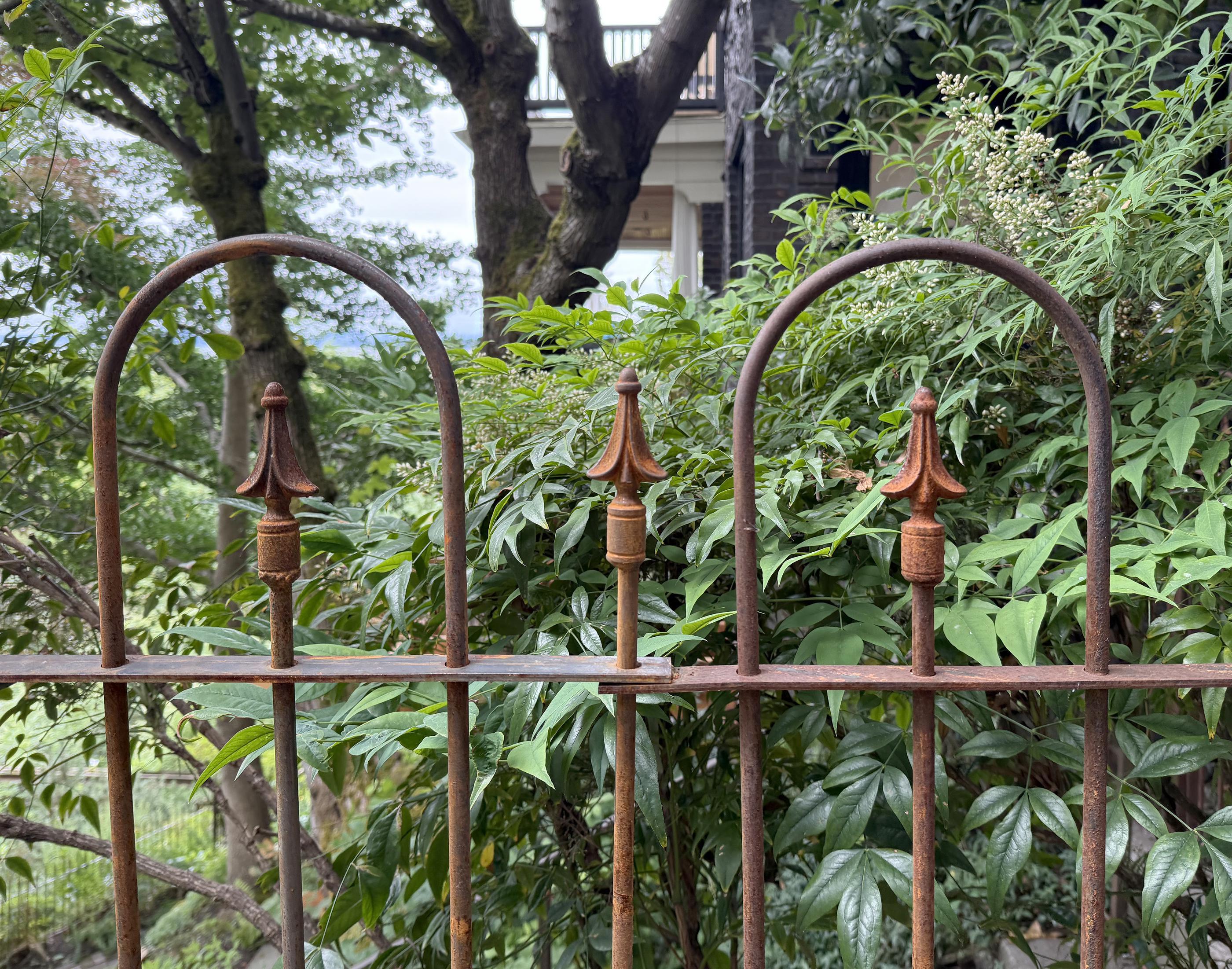 spear top ornamental metal fence installed by top rail fence