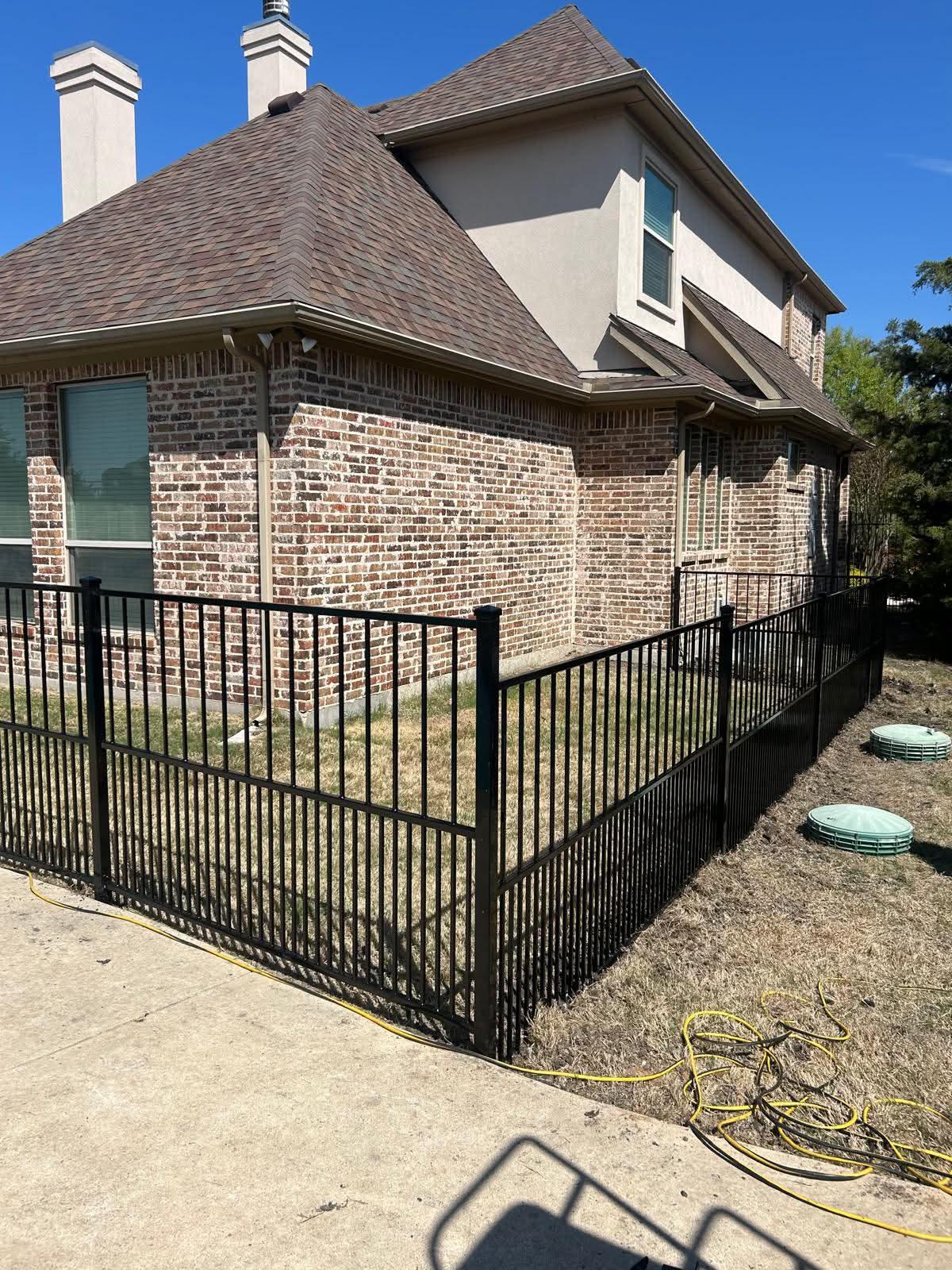 ornamental metal puppy picket fence installed by top rail fence