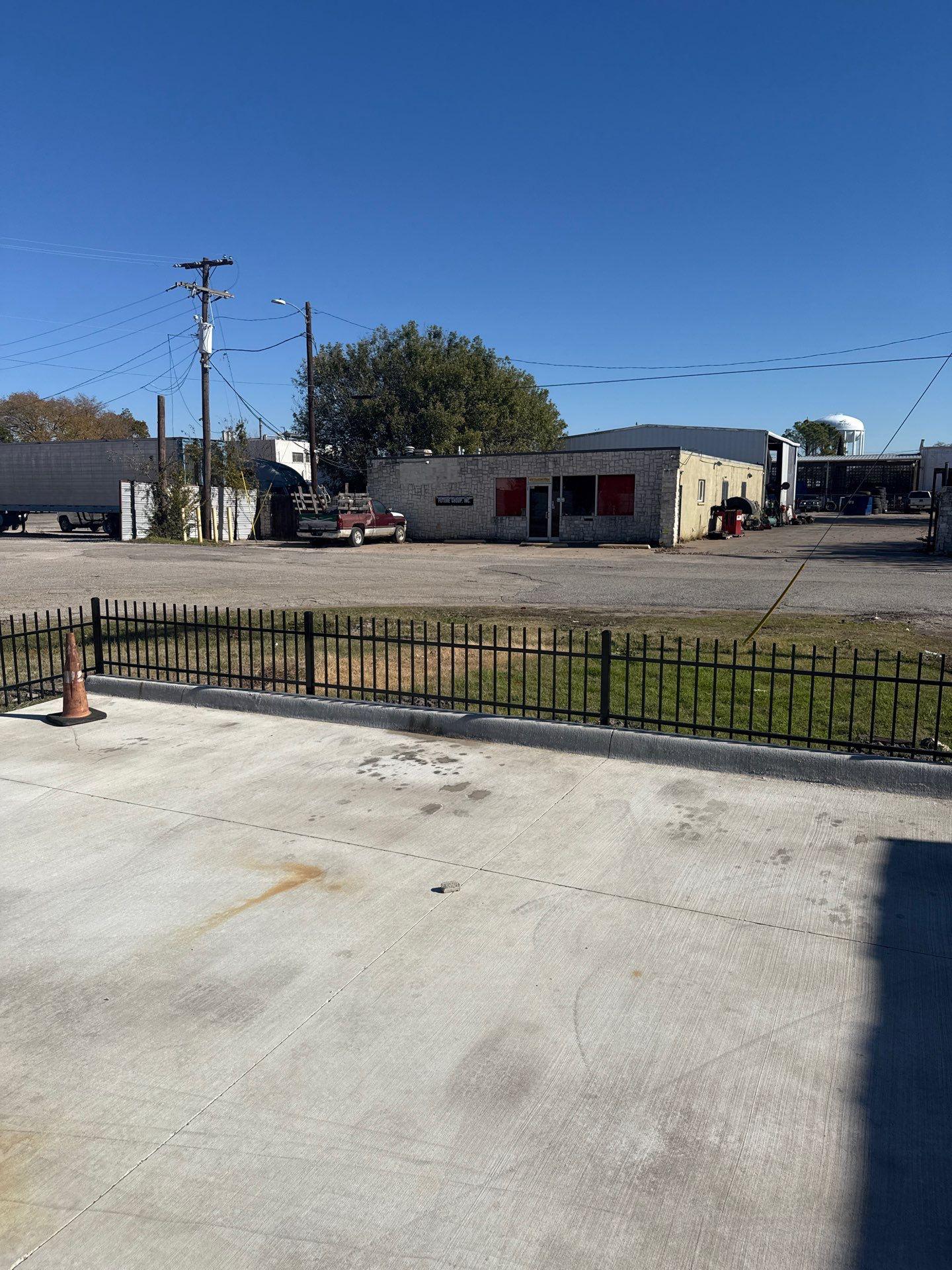 ornamental metal fence installed by top rail fence