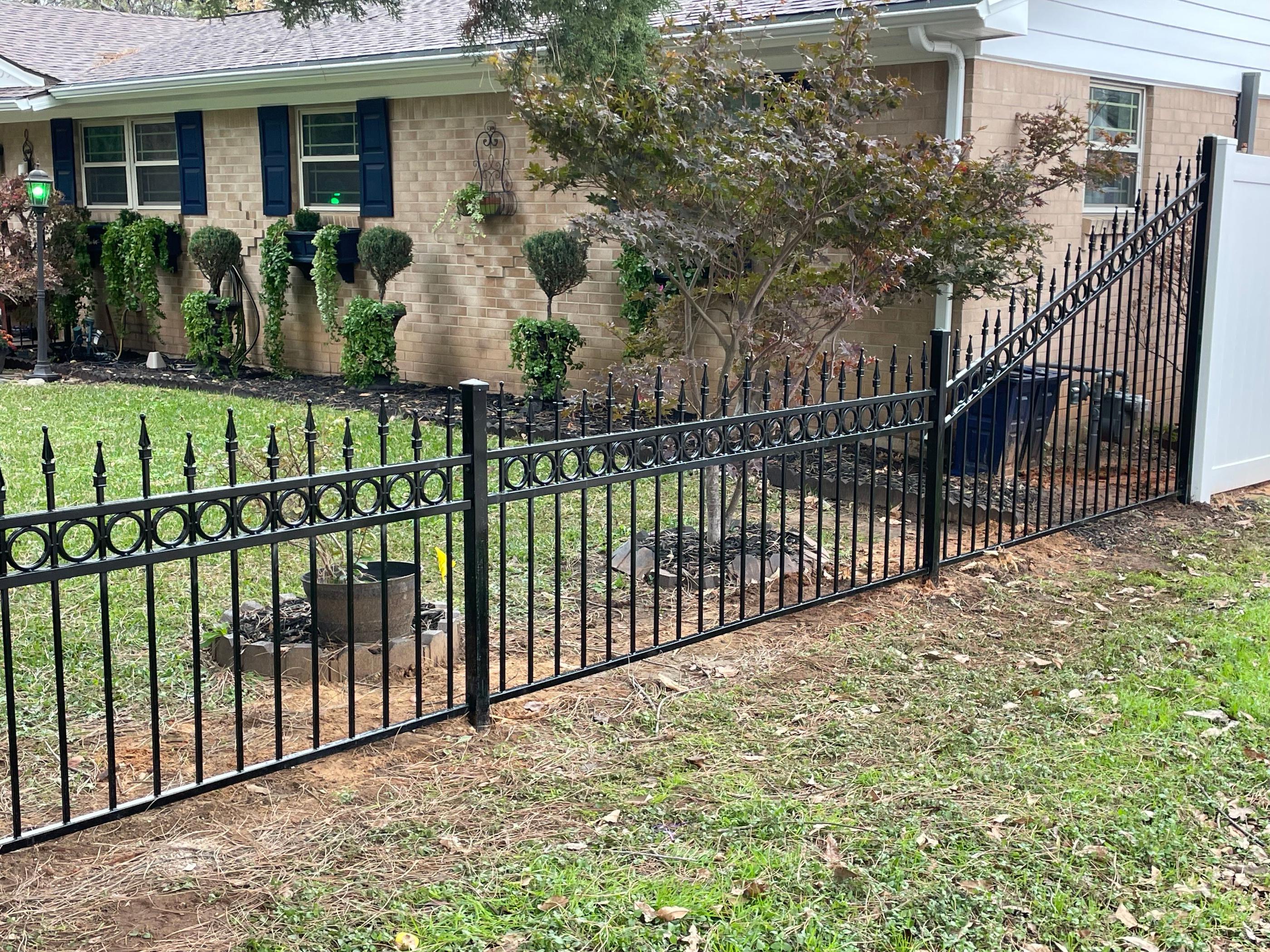 iron fence installed by top rail fence