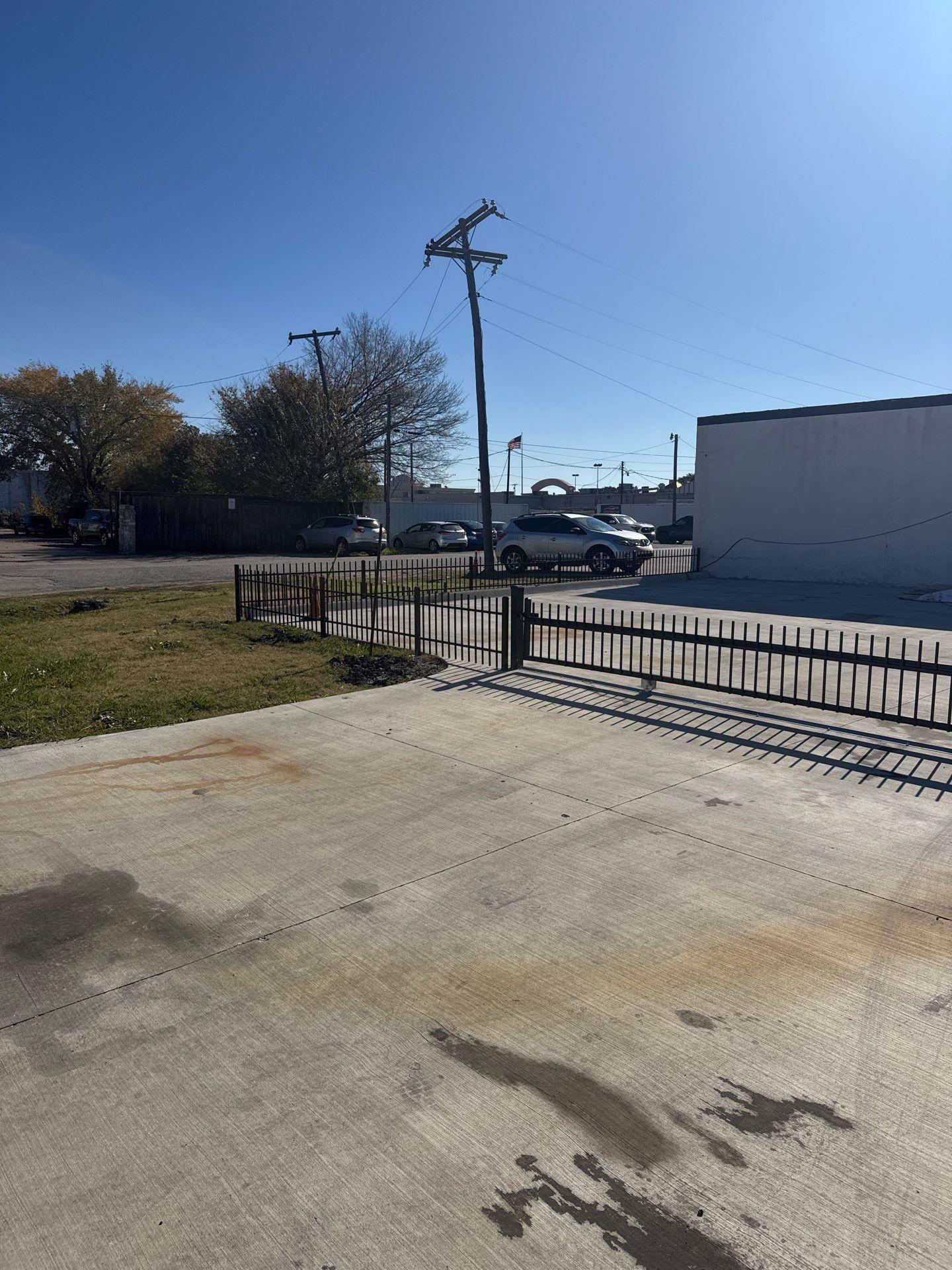ornamental metal fence installed by top rail fence