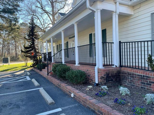 ornamental metal railing installed by top rail fence