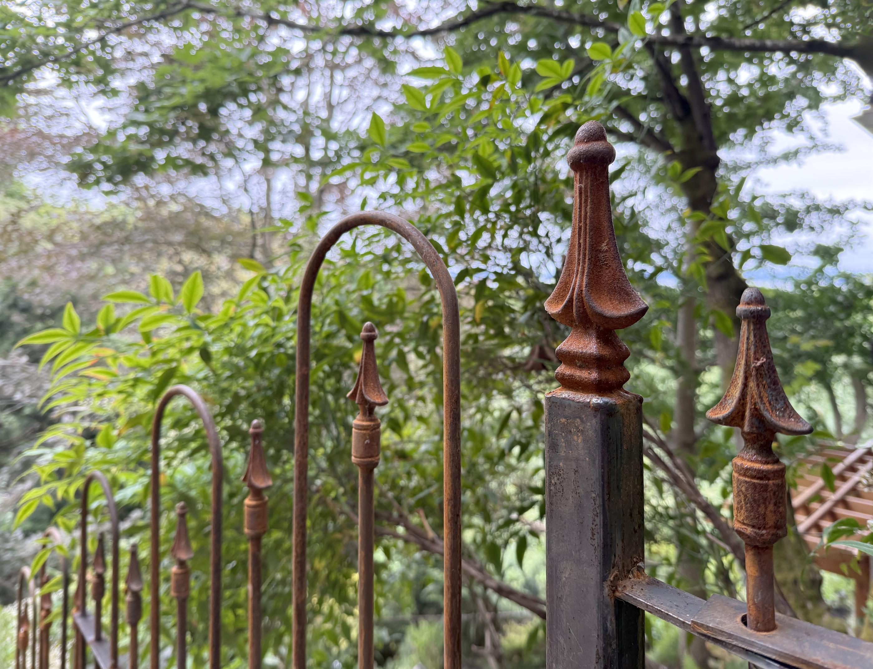 spear top ornamental metal fence installed by top rail fence