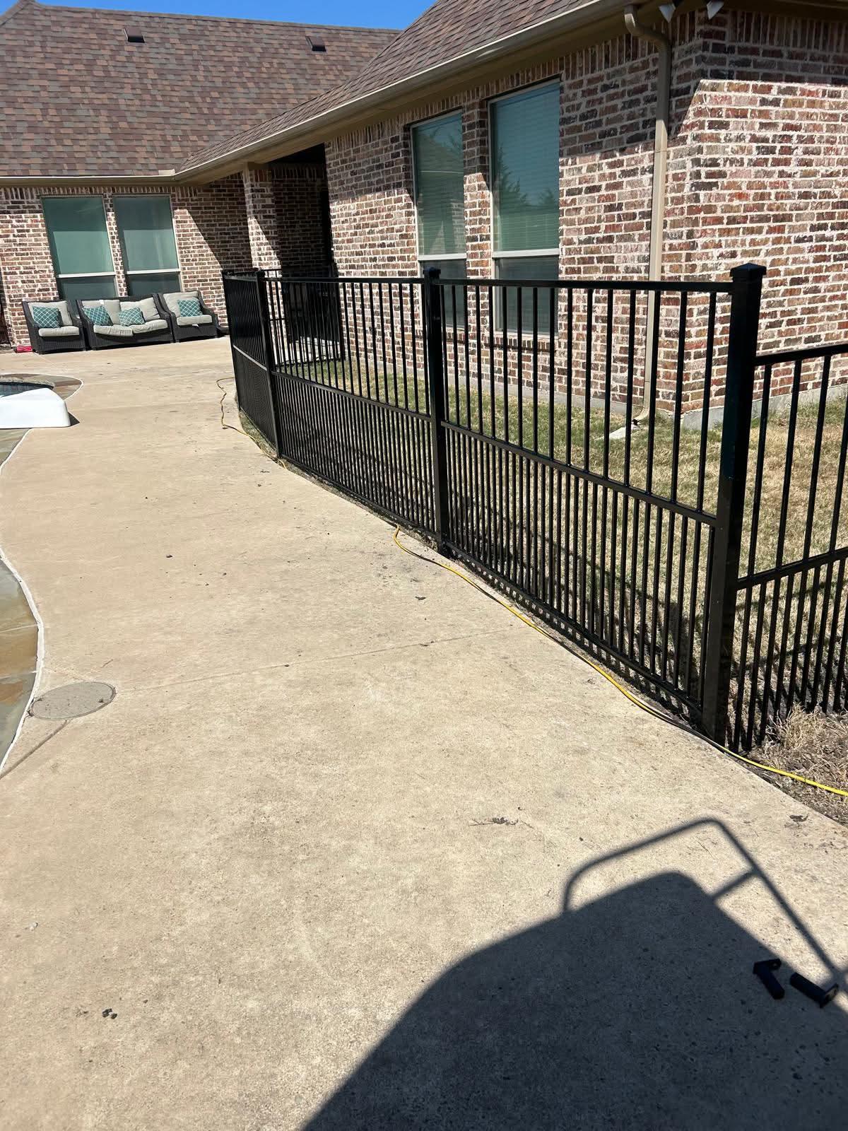ornamental metal puppy picket fence installed by top rail fence