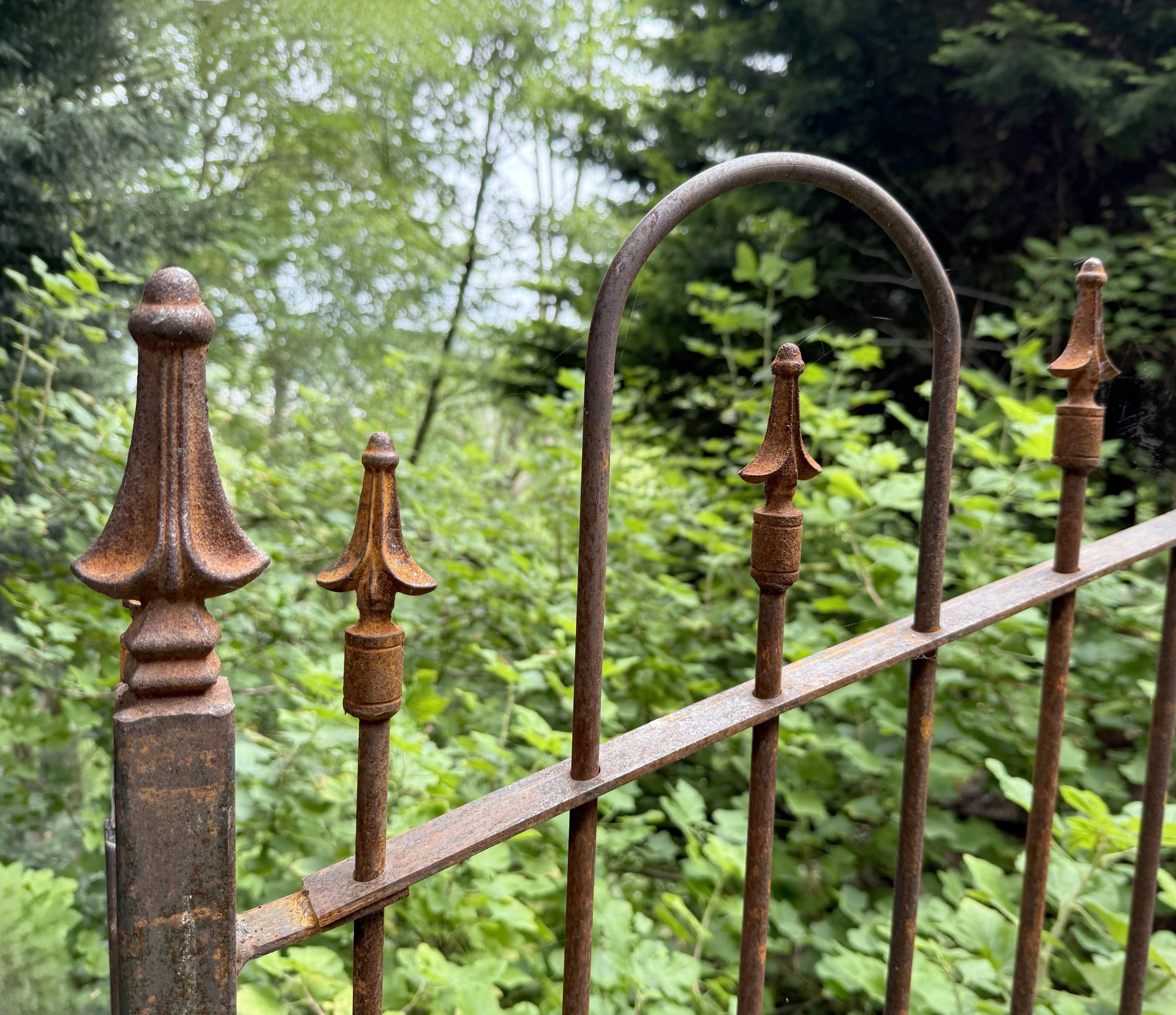 spear top ornamental metal fence installed by top rail fence