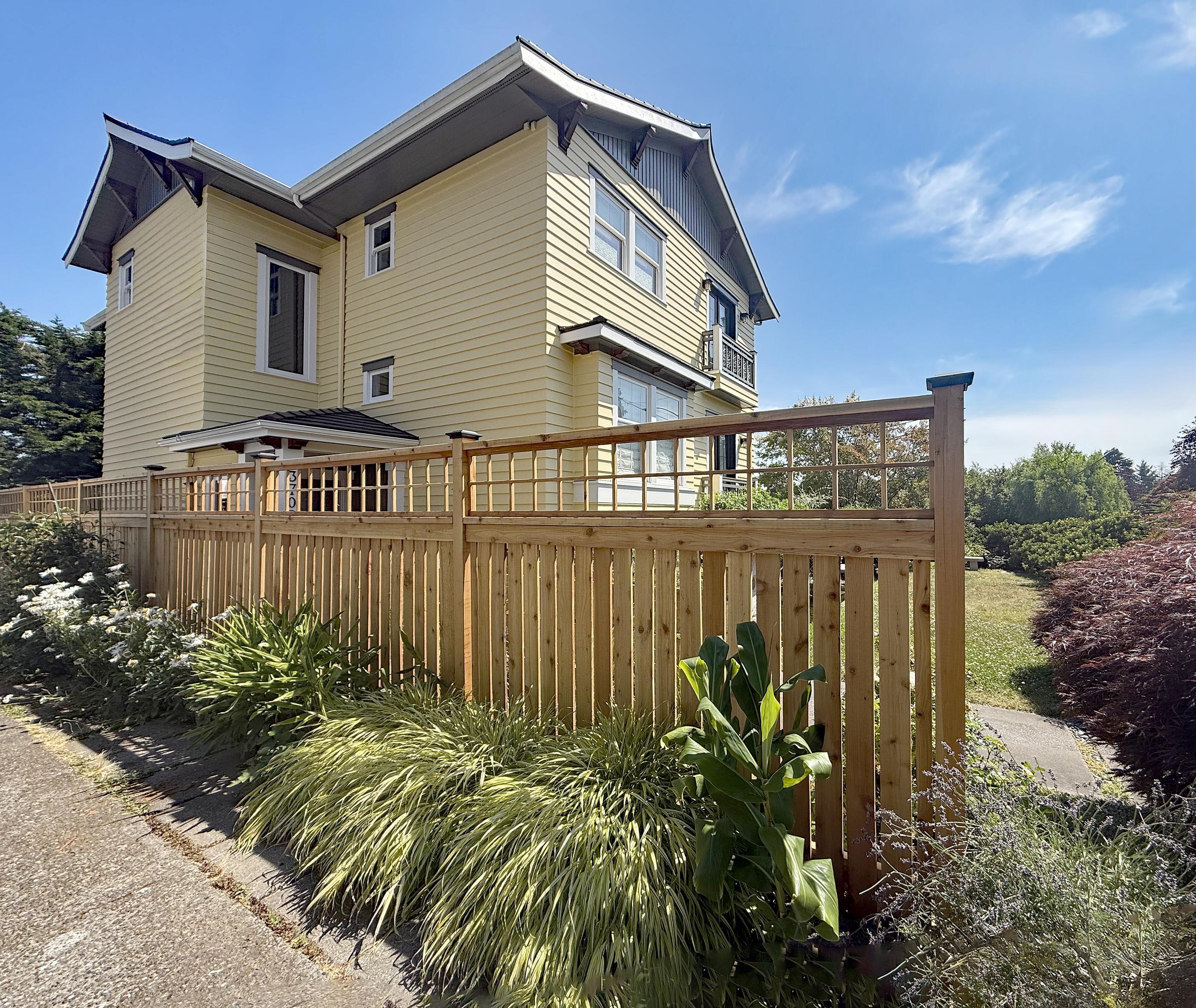 wood spaced picket fence installed by top rail fence