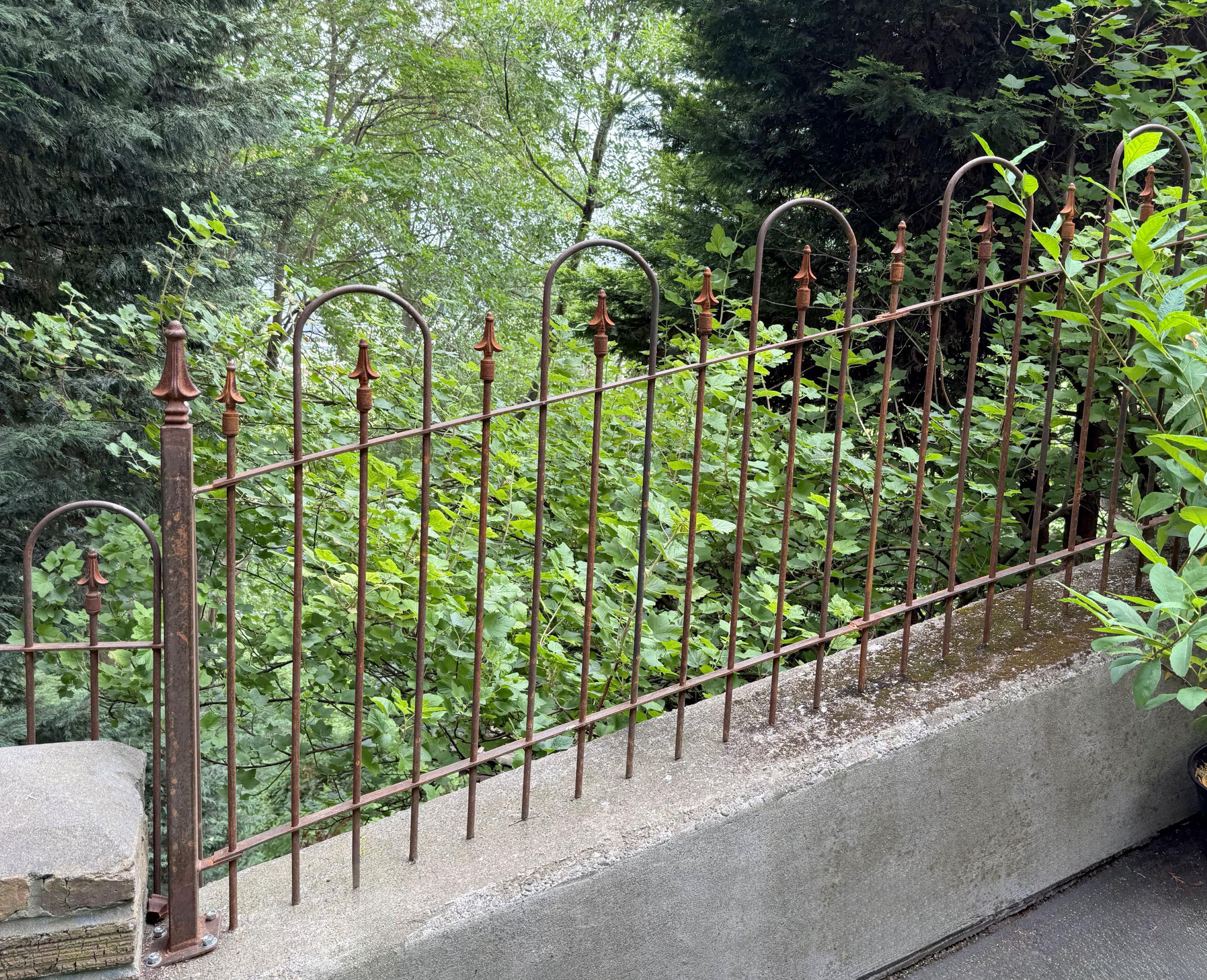 spear top ornamental metal fence installed by top rail fence