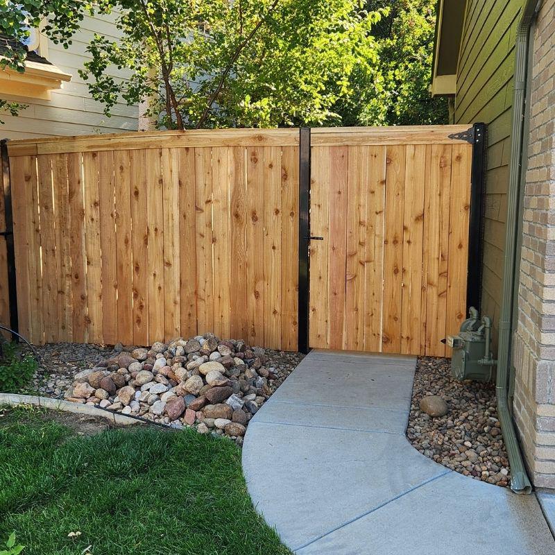 wood privacy fence with steel posts installed by Top Rail Fence