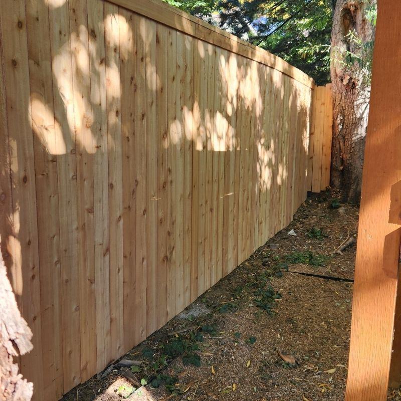 wood privacy fence installed by Top Rail Fence