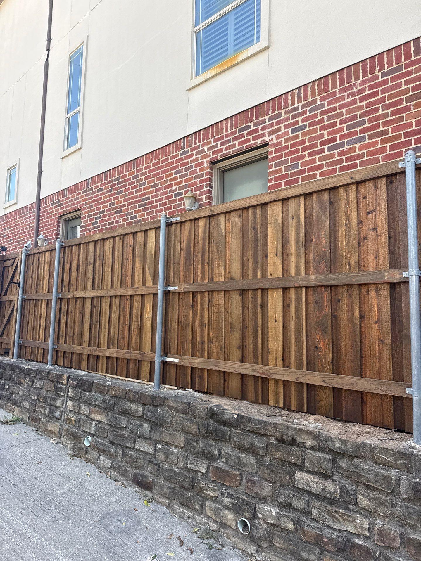 cedar board on board fence installed by top rail fence