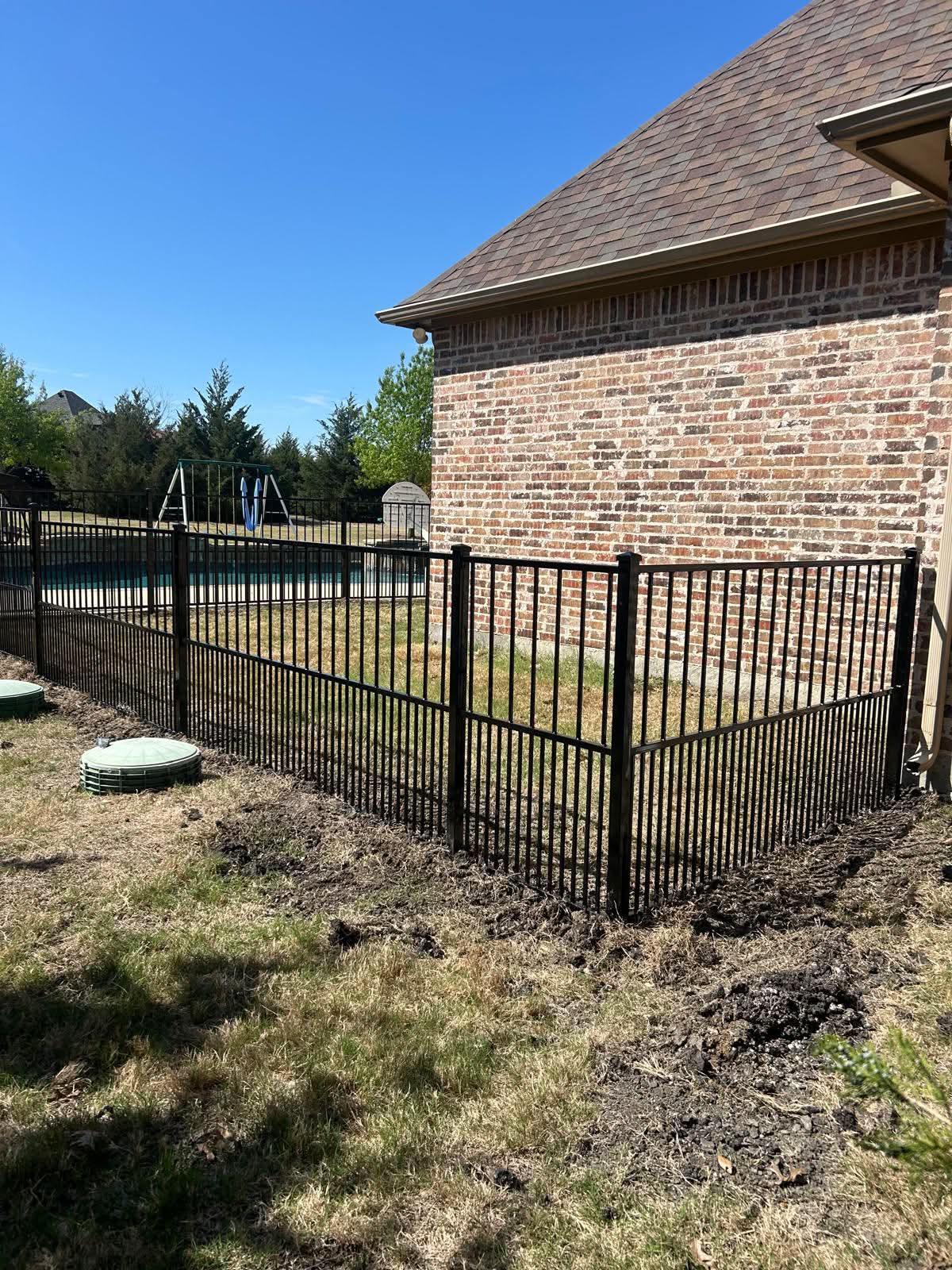 ornamental metal puppy picket fence installed by top rail fence