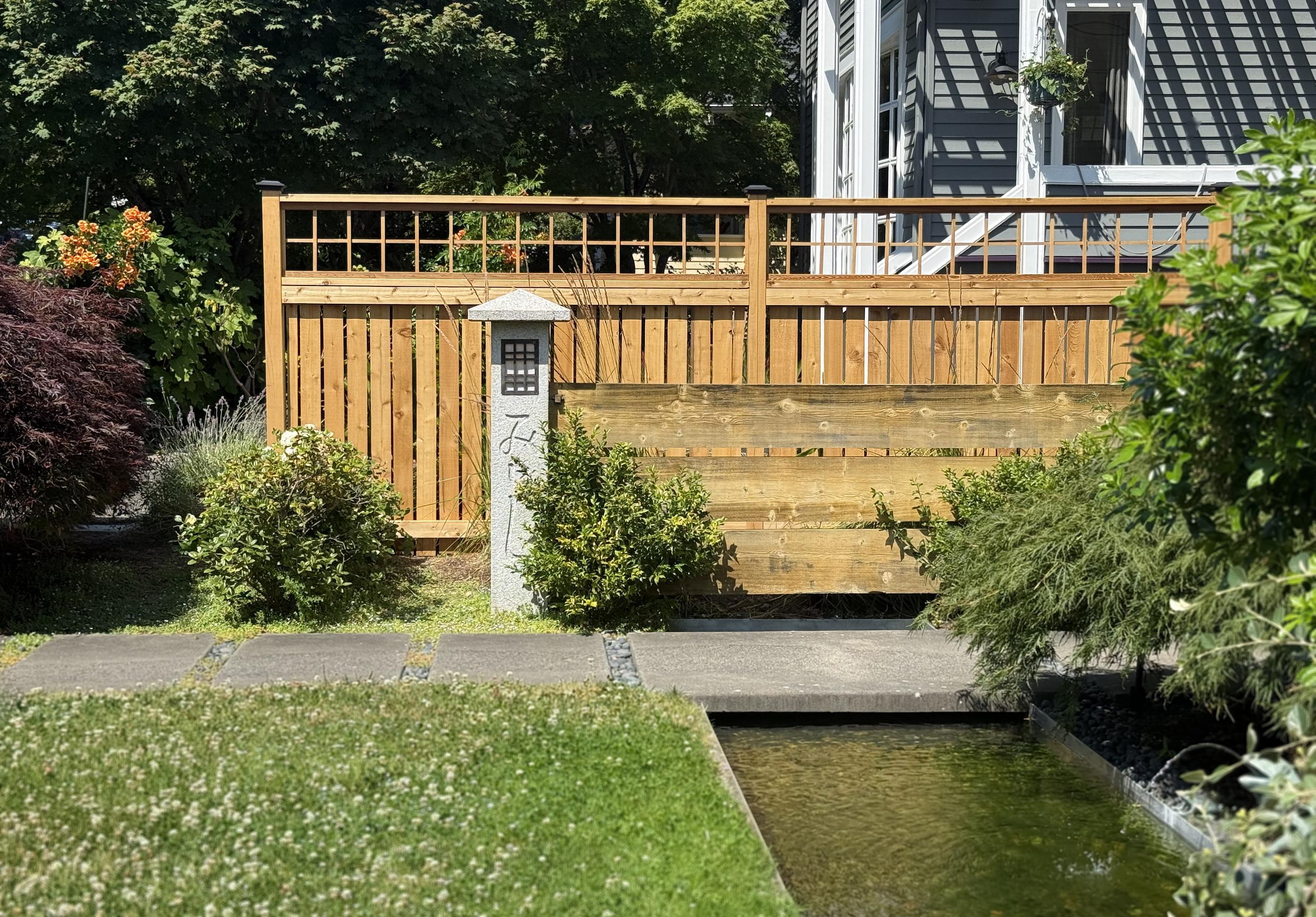 wood spaced picket fence installed by top rail fence