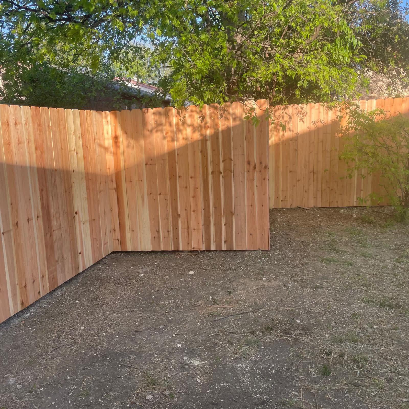 side by side wood fence installed by top rail fence