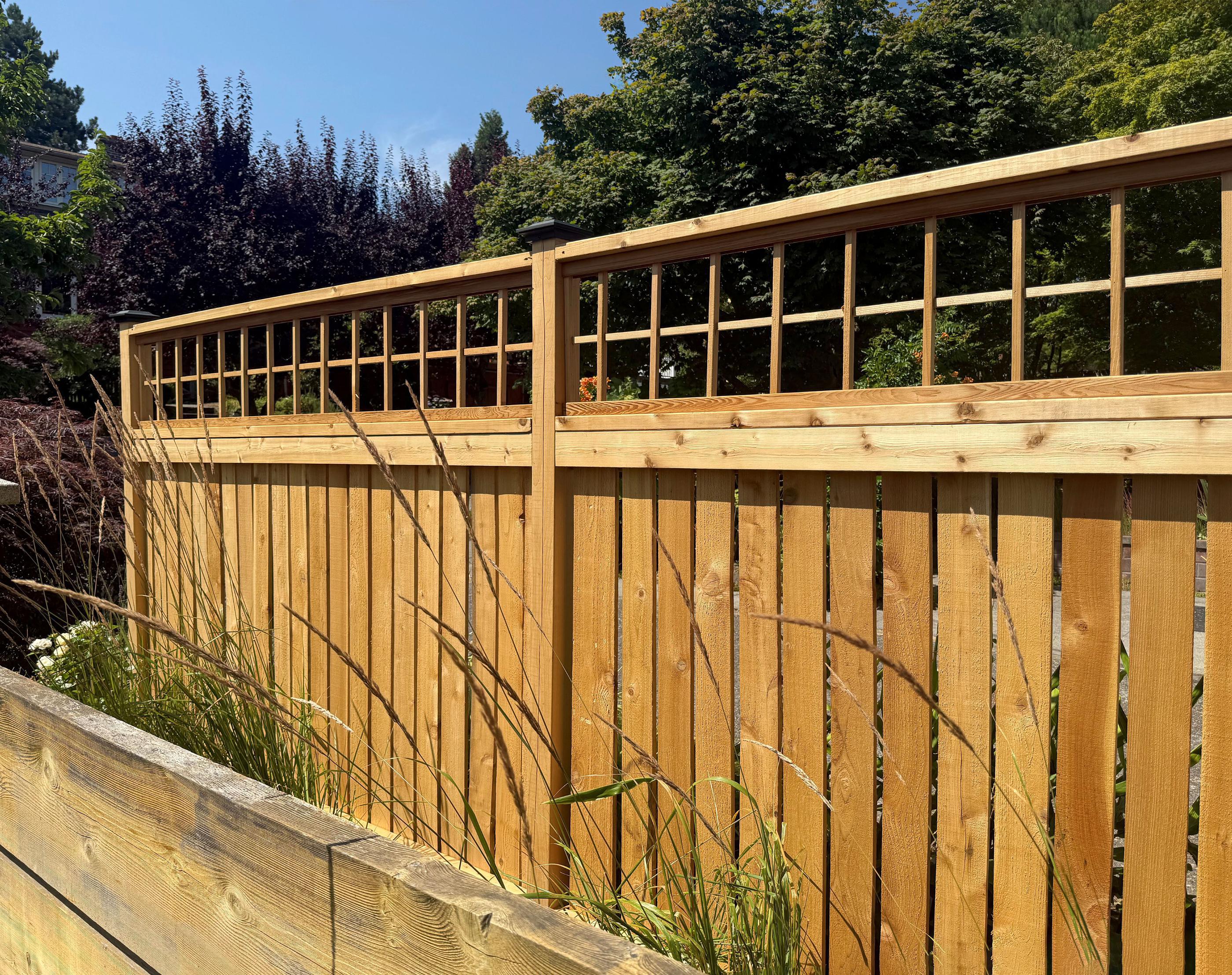 wood spaced picket fence installed by top rail fence
