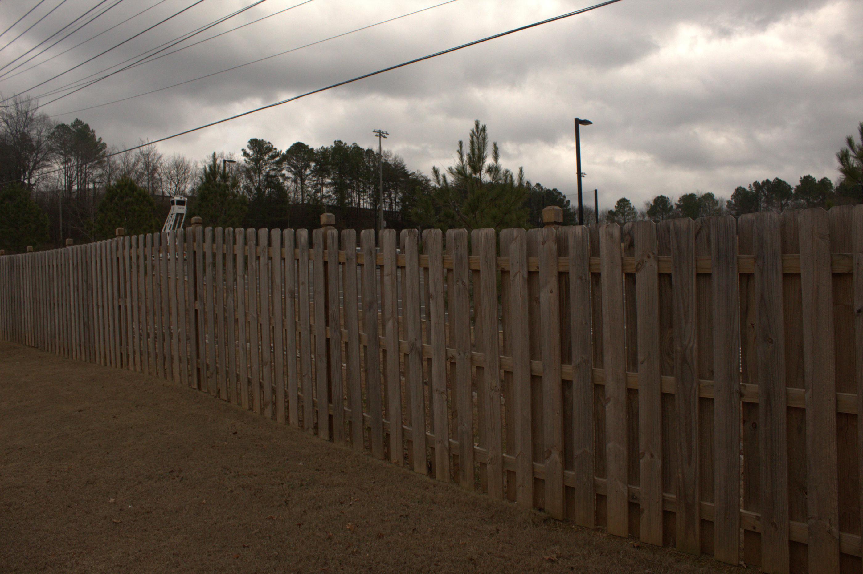 wood shadowbox fence installed by top rail fence