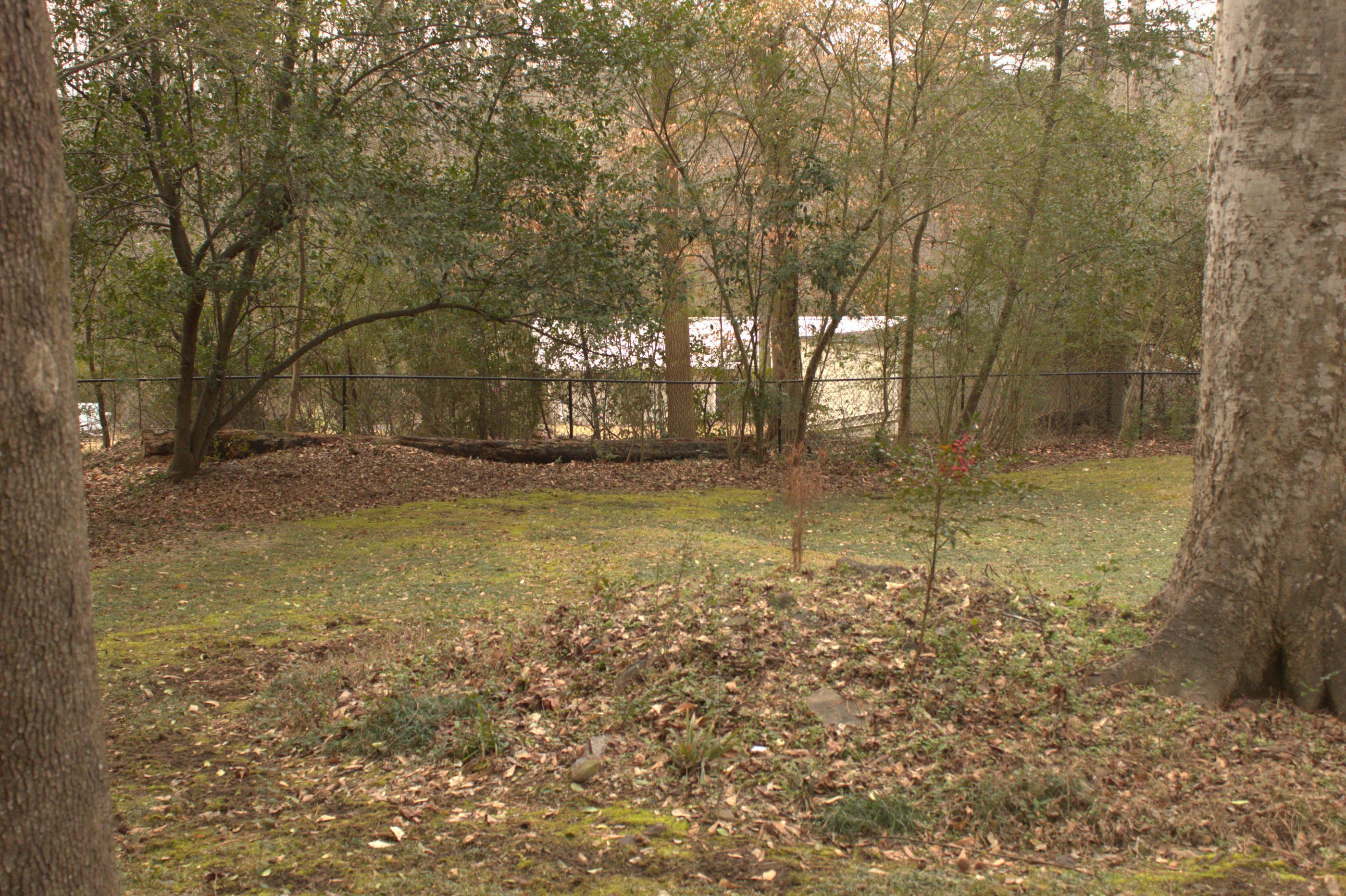 black chain link fence installed by top rail fence