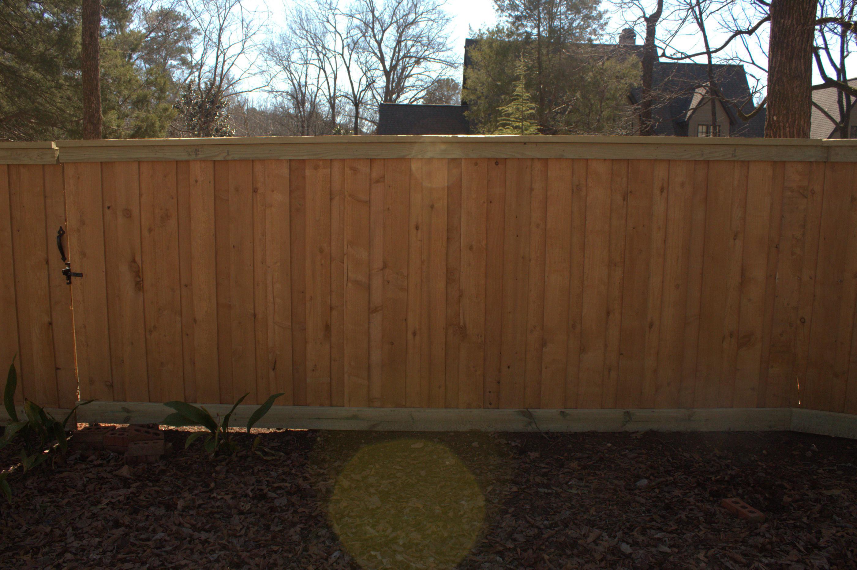 wood board on board fence installed by top rail fence