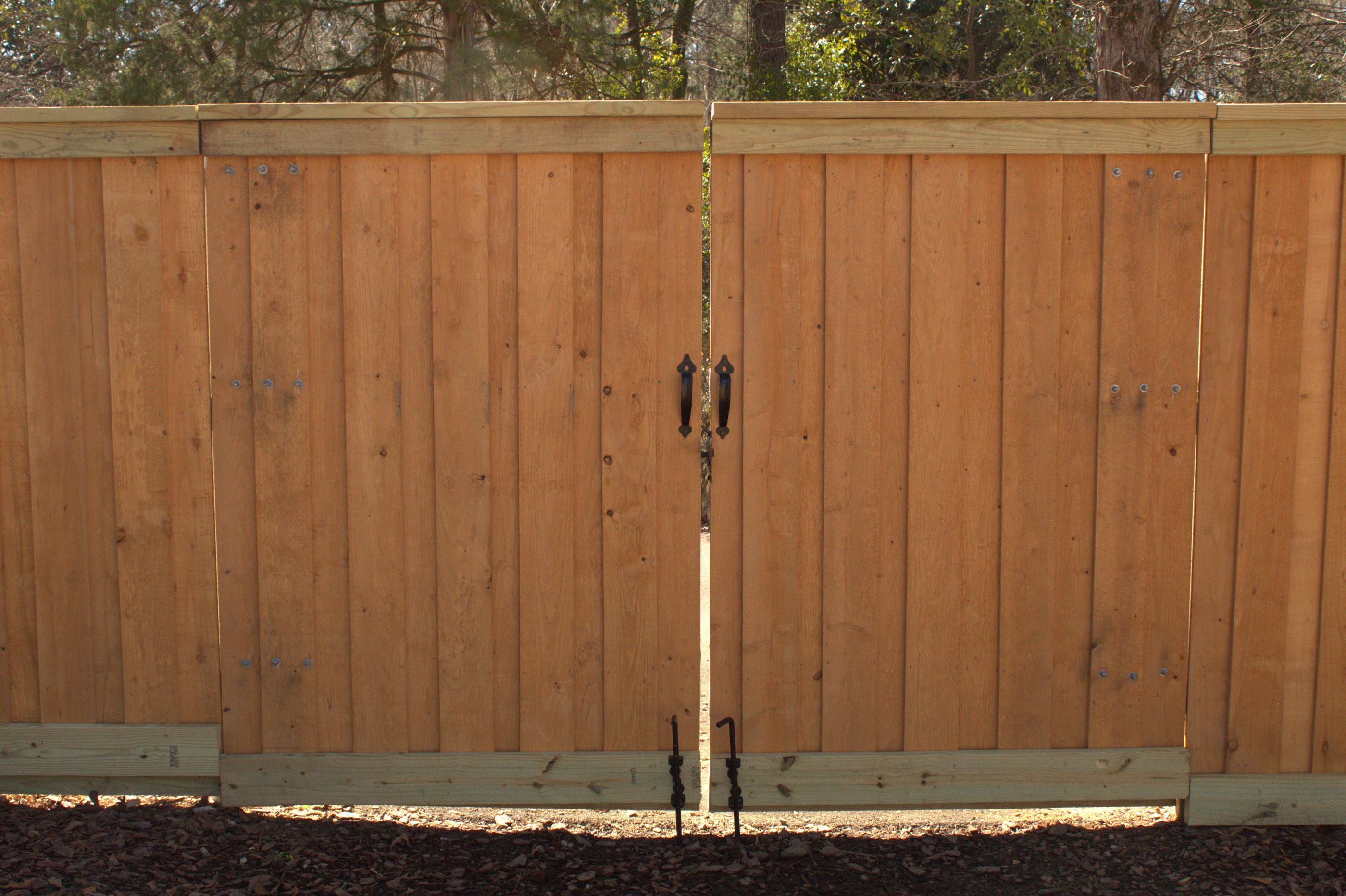 wood board on board fence installed by top rail fence