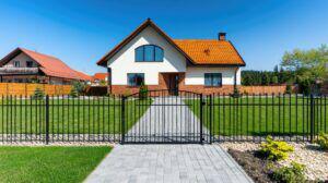 Black ornamental metal fence around a home