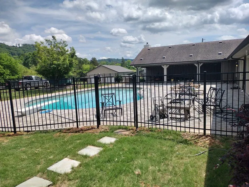 ornamental metal fence installed by top rail fence
