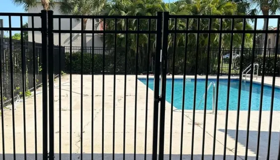 aluminum metal fence around a pool