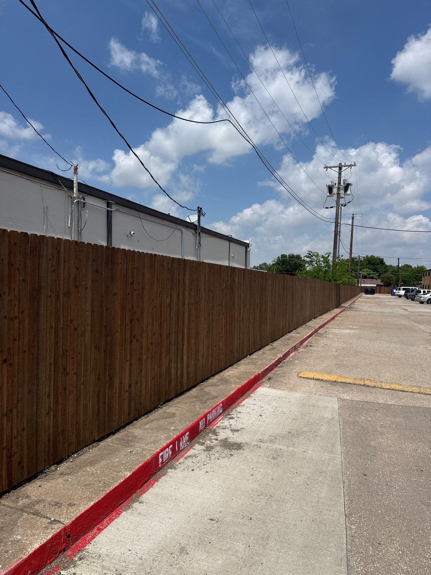 commercial fence installed by top rail fence